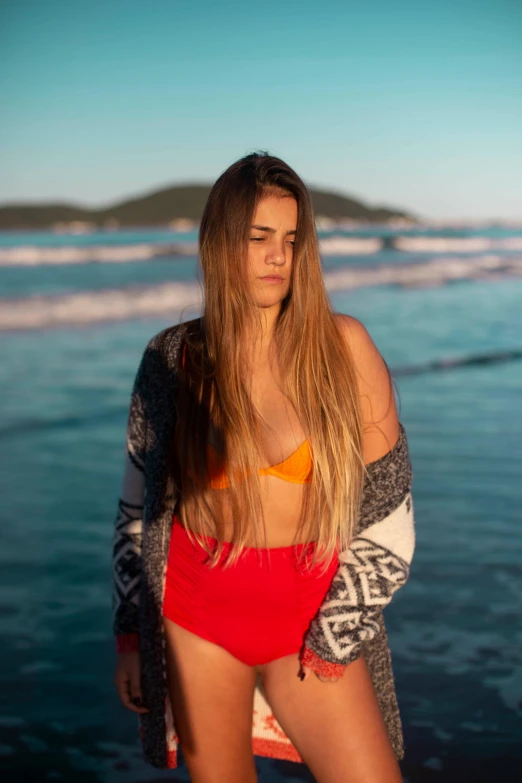 a woman standing on top of a beach next to the ocean, long glowing hair, brazilan supermodel, profile image, large)}]