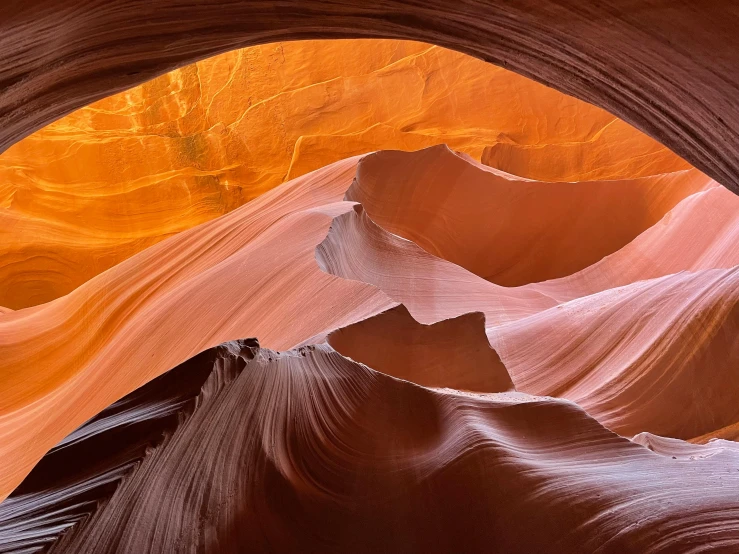 a view of the inside of a canyon, pexels contest winner, art nouveau, desert colors, 2022 photograph, sweeping arches, photorealist