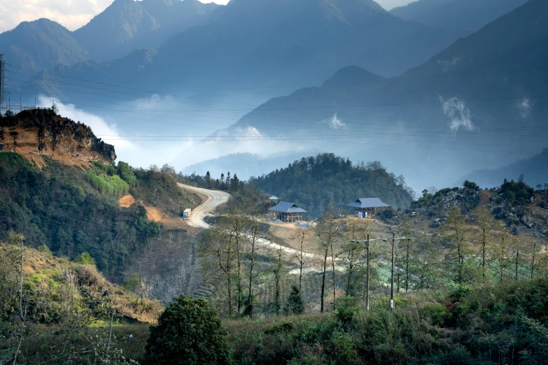 a view of the mountains from the top of a hill, by Lee Loughridge, unsplash contest winner, sumatraism, vietnamese temple scene, houses and roads, avatar image