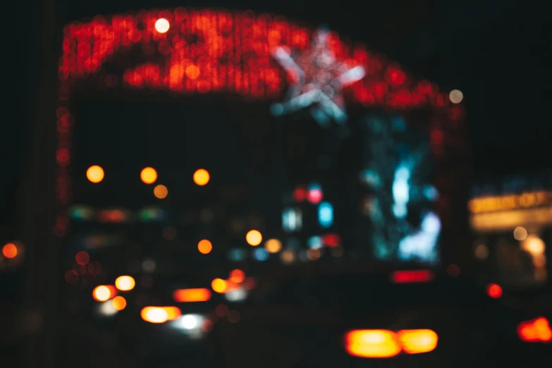 a city street filled with lots of traffic at night, an album cover, pexels contest winner, visual art, overcast bokeh - c 5, red neon, christmas night, billboard image