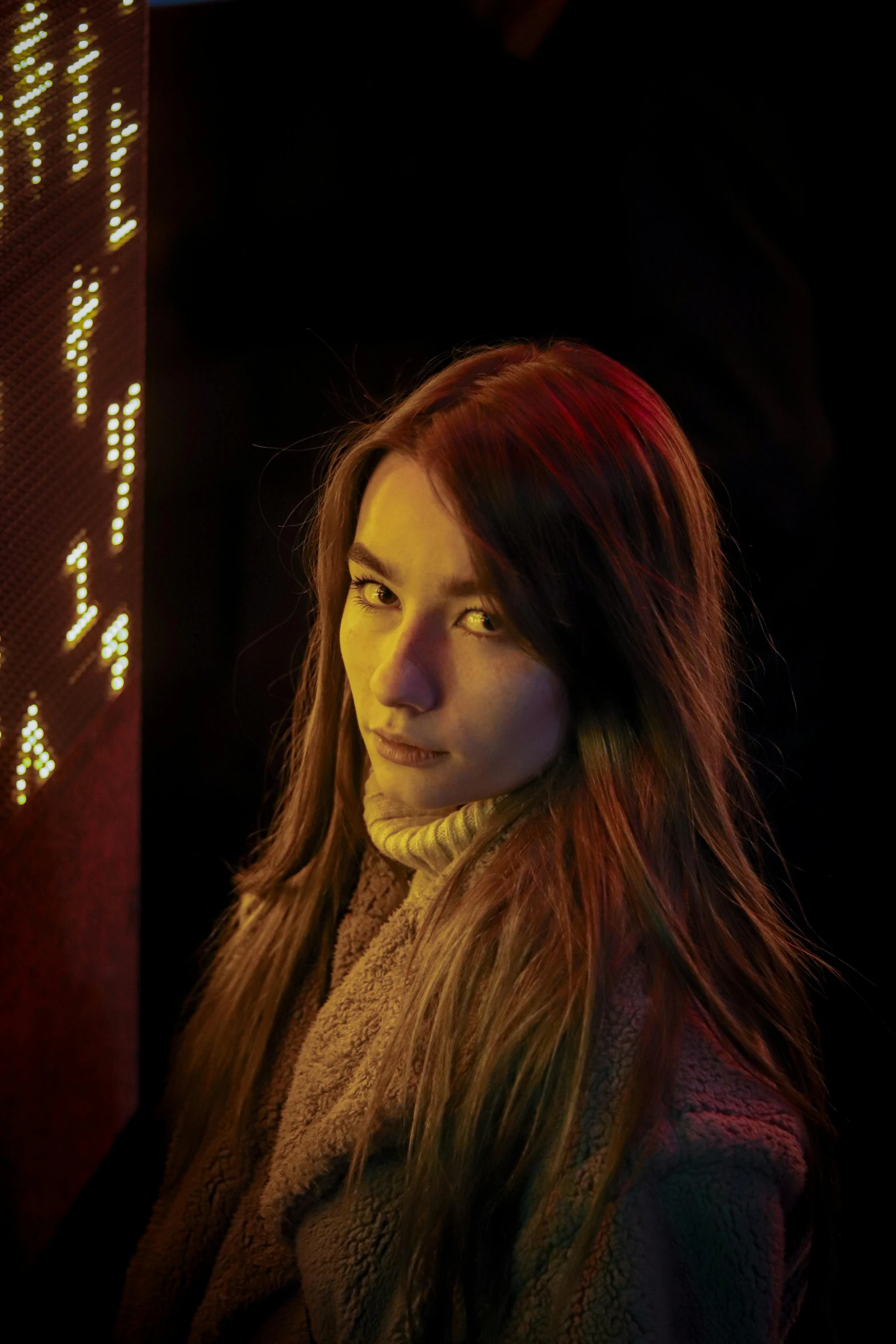 a woman standing in front of a neon sign, a picture, inspired by Elsa Bleda, digital art, with long hair and piercing eyes, ((portrait)), color photograph portrait 4k, a young woman as genghis khan