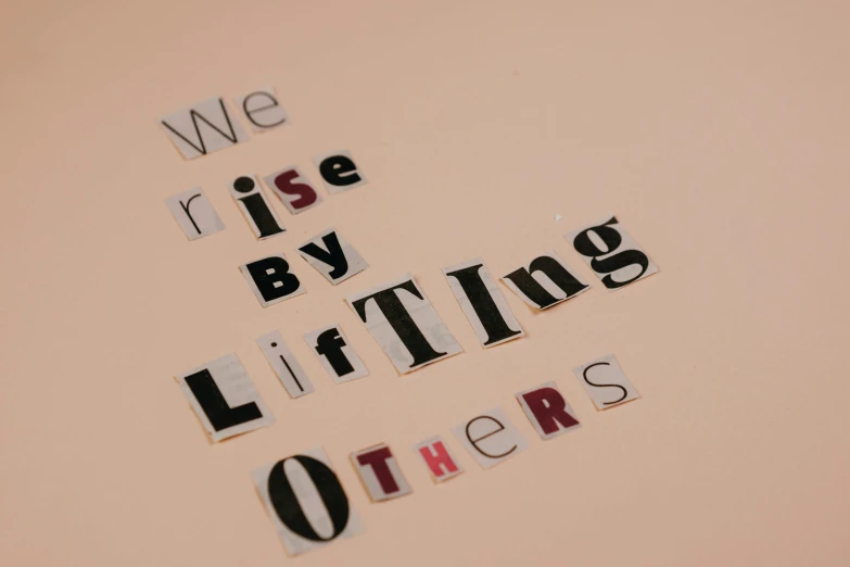 we rise by lifting others, an album cover, by Lee Loughridge, unsplash, letterism, crafting, blushing, ethics, lying