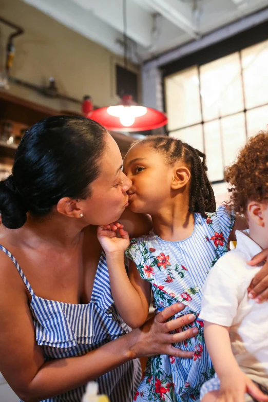 a woman and two small children in a kitchen, pexels, incoherents, portrait of two girls kissing, mixed race, 15081959 21121991 01012000 4k, center focused