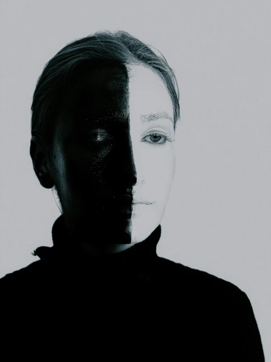 a black and white photo of a woman's face, a black and white photo, inspired by Anna Füssli, johan liebert mixed with alucard, symmetrical face and full body, half and half, face illuminated