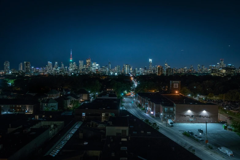 an aerial view of a city at night, by Carey Morris, unsplash contest winner, hyperrealism, toronto, seen from far away, neighborhood, summer night