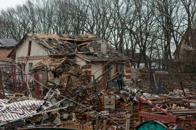 a pile of rubble in front of a house, a photo, by Adam Marczyński, tornado, avatar image