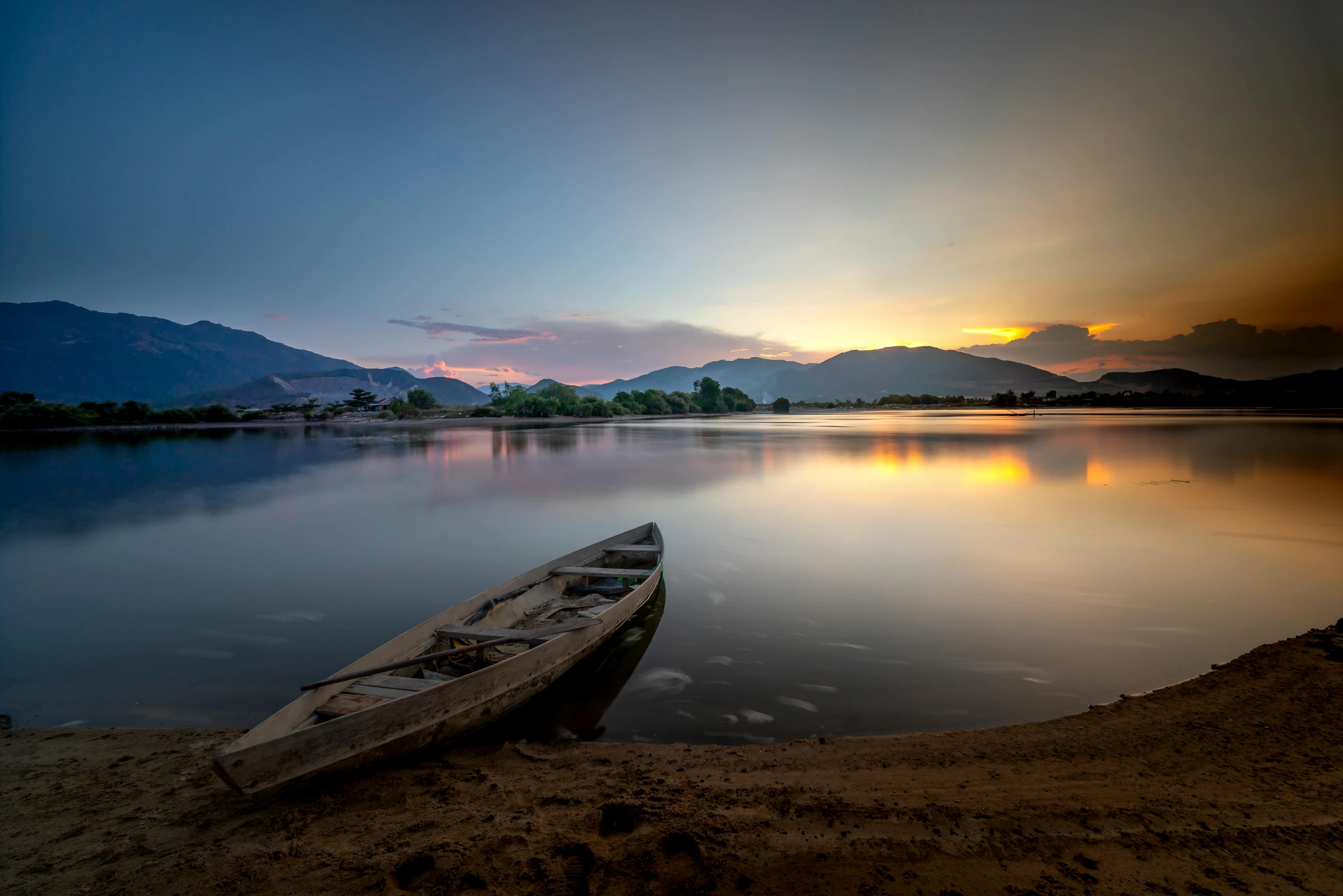 a boat sitting on top of a beach next to a body of water, by Ibrahim Kodra, pexels contest winner, laos, spring evening, a photo of a lake on a sunny day, slide show