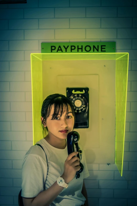 a woman holding a microphone in front of a payphone, by Raymond Han, photo booth, dilraba dilmurat, python, high quality image