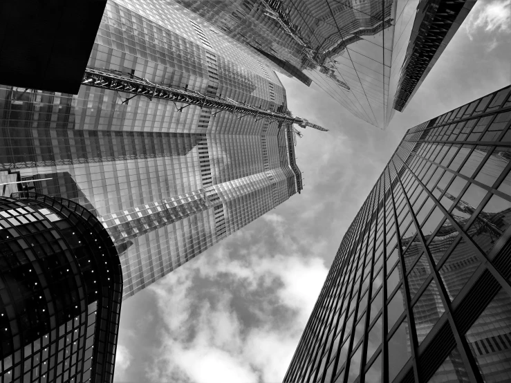 a black and white photo of skyscrapers in a city, inspired by Thomas Struth, pexels contest winner, upside - down, full of glass. cgsociety, kuala lumpur, vertical