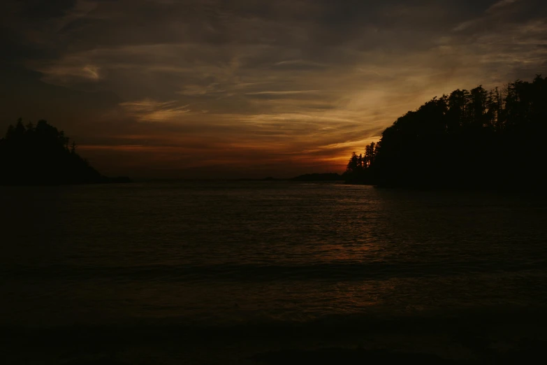 the sun is setting over a body of water, pexels contest winner, romanticism, night time low light, abel tasman, brown, medium format. soft light