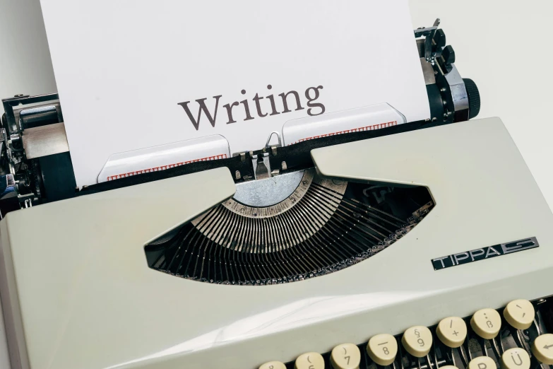 a typewriter with a piece of paper on top of it, an album cover, by Carey Morris, unsplash, 15081959 21121991 01012000 4k, lettering, white, panel