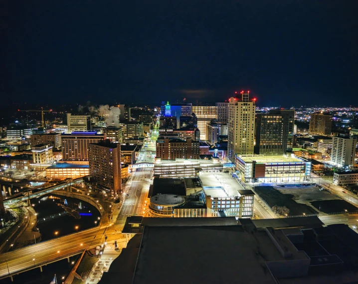 an aerial view of a city at night, by Greg Rutkowski, pexels contest winner, rhode island, city rooftop, omnious background, vacation photo