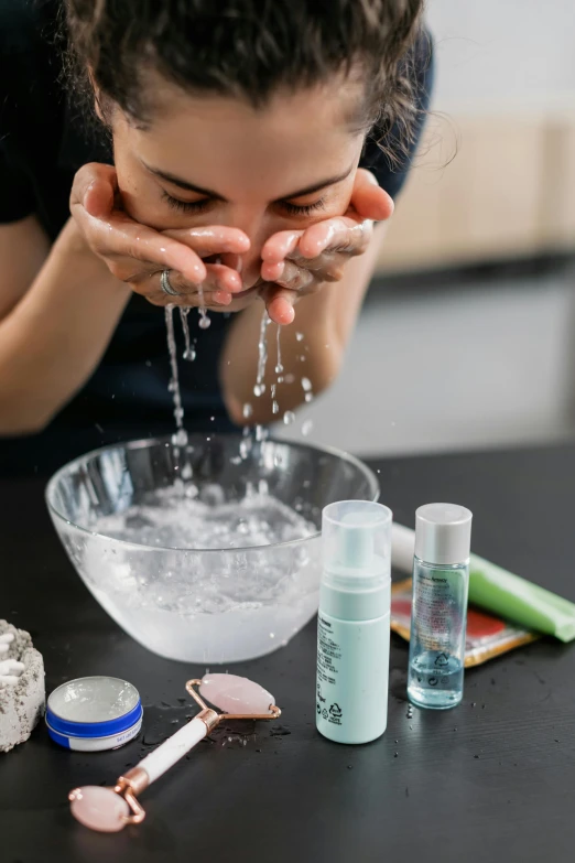 a woman is washing her face with water, a hyperrealistic painting, inspired by Elsa Bleda, trending on pexels, experimenting in her science lab, resin, bubbly, 278122496