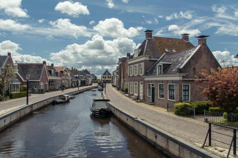 a canal running through a small town on a sunny day, by Eglon van der Neer, pexels contest winner, fan favorite, thatched roofs, 2022 photograph, slide show