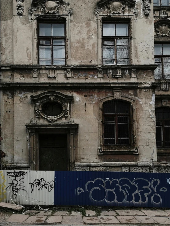 a building with graffiti on the side of it, a photo, by Kristian Zahrtmann, renaissance era, old scars, background image, budapest