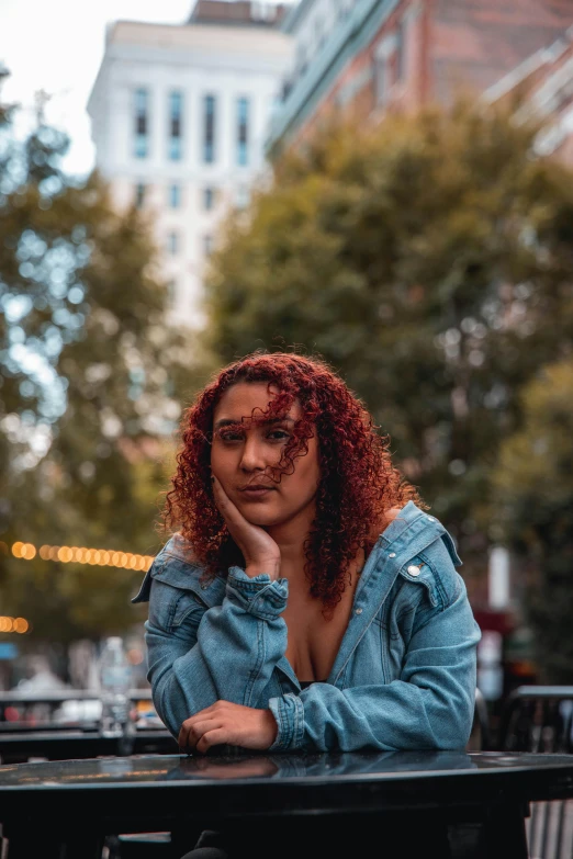 a woman with red hair sitting at a table, trending on pexels, mixed race, in new york city, portrait shot 8 k, thicc