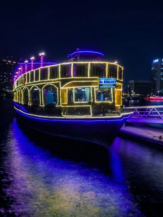 a boat that is sitting in the water, dau-al-set, with neon lights, profile image, multiple stories, sheikh