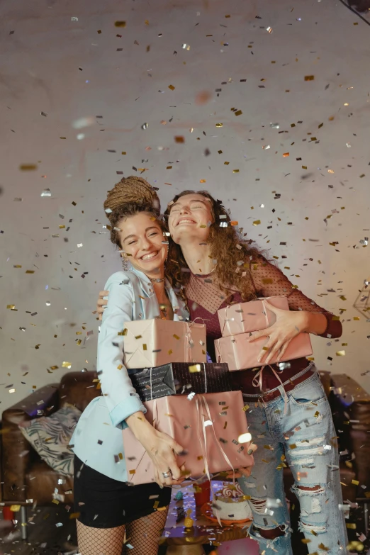 a couple of women standing next to each other, pexels contest winner, happening, birthday wrapped presents, glittering stars scattered about, lesbian embrace, sydney sweeney