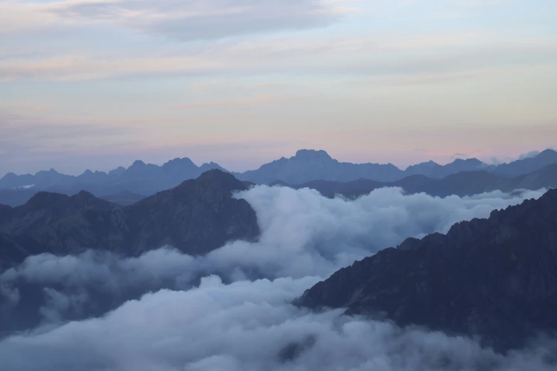 a couple of people standing on top of a mountain, pexels contest winner, romanticism, view above the clouds, larapi, late summer evening, panoramic view