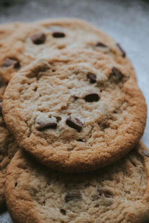 chocolate chip cookies stacked on top of each other, by Robbie Trevino, pexels, close up high detailed, 6 pack, tans, handcrafted