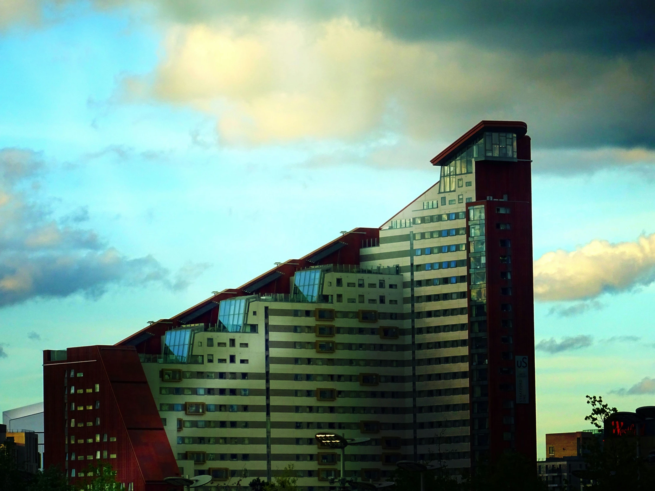 a very tall building sitting in the middle of a city, a matte painting, inspired by Victor Enrich, pexels contest winner, brutalism, neo norilsk, eyelevel!!! view!!! photography, psychedelic architecture, hospital