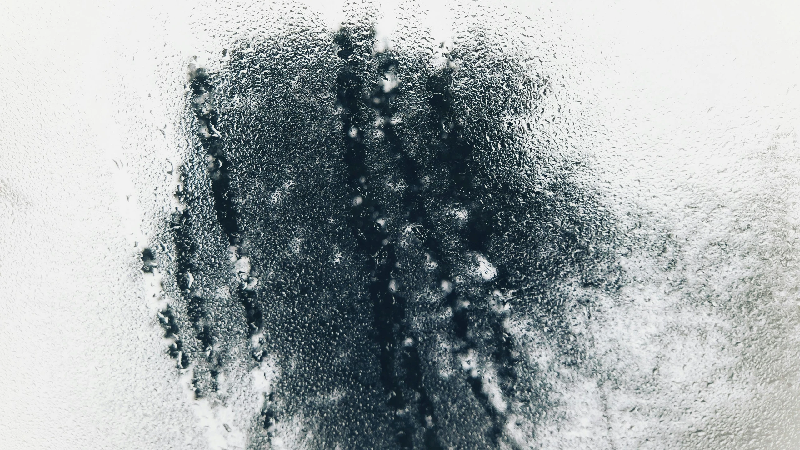 a black and white photo of a person through a window, a stipple, by Micha Klein, pexels, conceptual art, condensation drip, abstract liquid, high angle close up shot, moldy