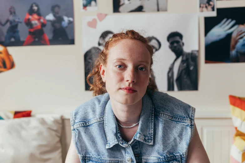 a woman sitting at a table with a plate of food in front of her, an album cover, by Emma Andijewska, renaissance, ginger hair with freckles, wearing double denim, riyahd cassiem, in her room