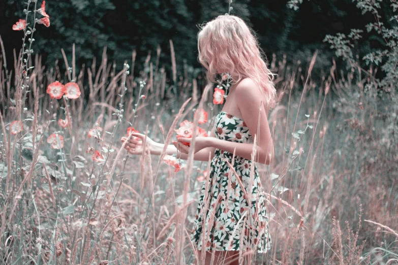 a woman standing in a field of tall grass, pexels contest winner, romanticism, pink white and green, plethora of colors ; mini dress, monochrome, picking up a flower