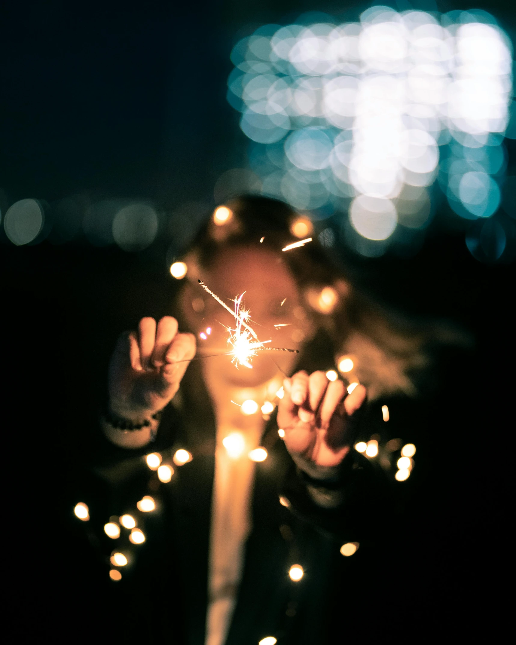 a woman holding a sparkler in front of her face, inspired by Elsa Bleda, happening, snapchat photo, ilustration, grainy photo, instagram post