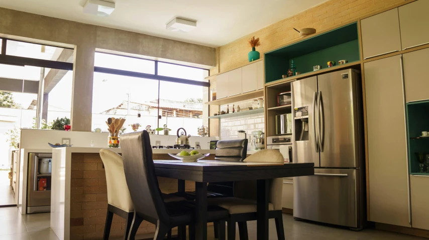 a kitchen with a table and chairs in it, pexels contest winner, light and space, fan favorite, neighborhood, hd footage, stainless steal