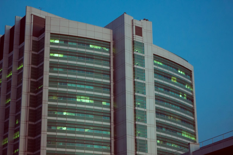 a very tall building with a lot of windows, hospital lighting, ignacio fernandez rios ”, cyan shutters on windows, uhq