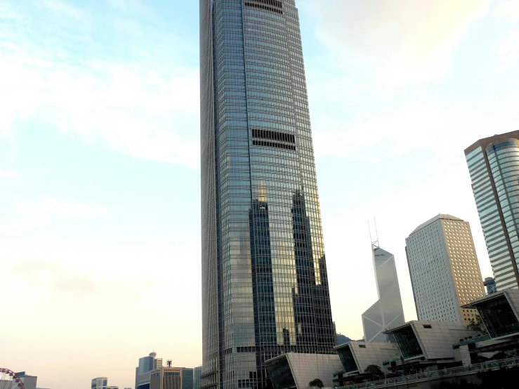 a very tall building sitting in the middle of a city, a picture, inspired by Cheng Jiasui, hurufiyya, avatar image, exterior view, exterior, former