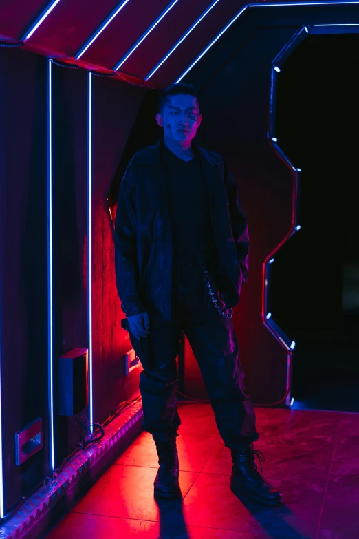 a man standing in a room with neon lights, wearing space techwear, like andy lau, damien tran, sith lord