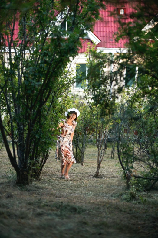 a woman walking through a lush green forest, a portrait, inspired by Konstantin Somov, flickr, in front of the house, in the steppe, sha xi, street photo