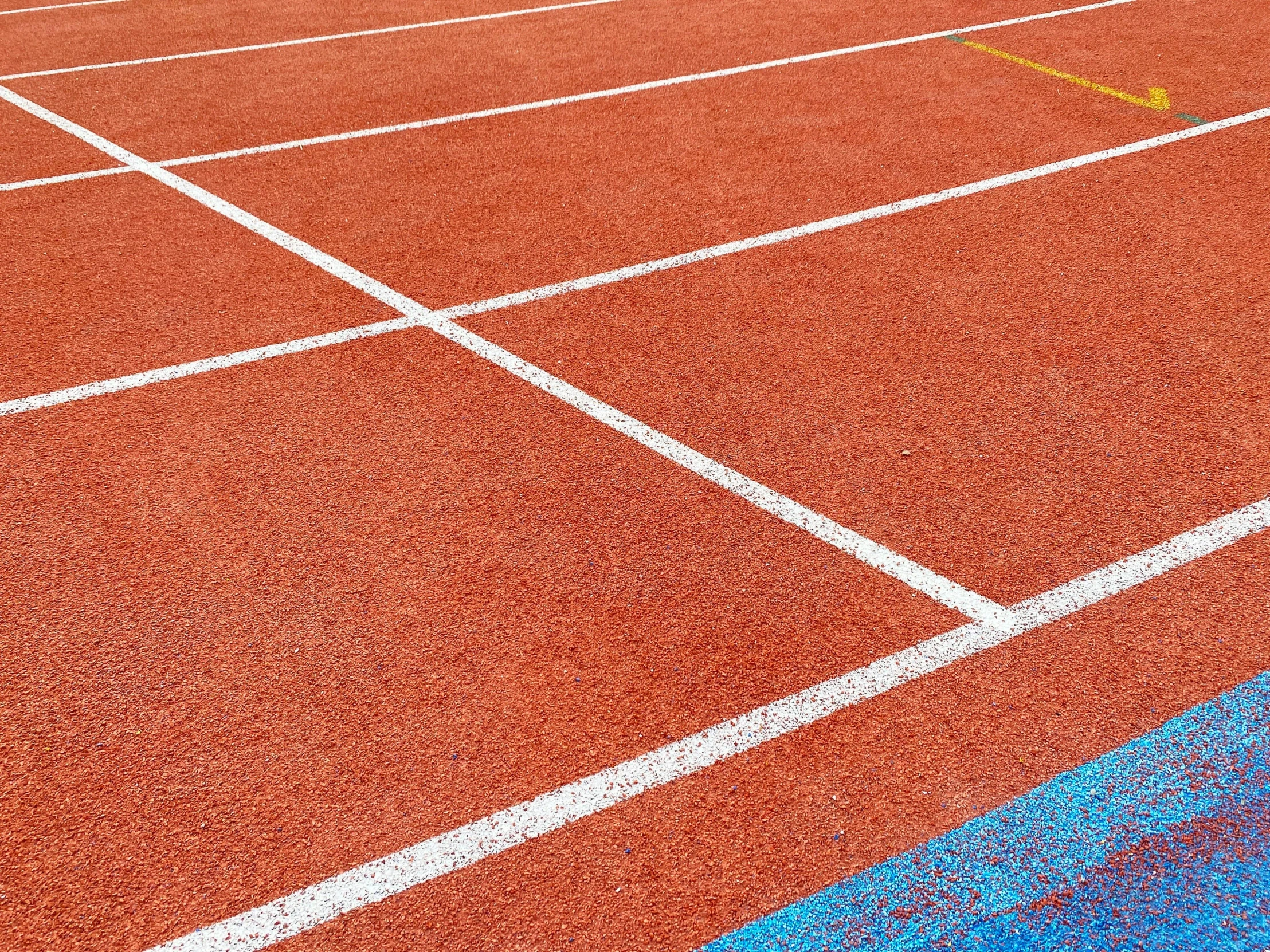 a tennis court with lines painted on it, by Anna Findlay, unsplash, process art, square, sprinters in a race, brand colours are red and blue, close-up photo