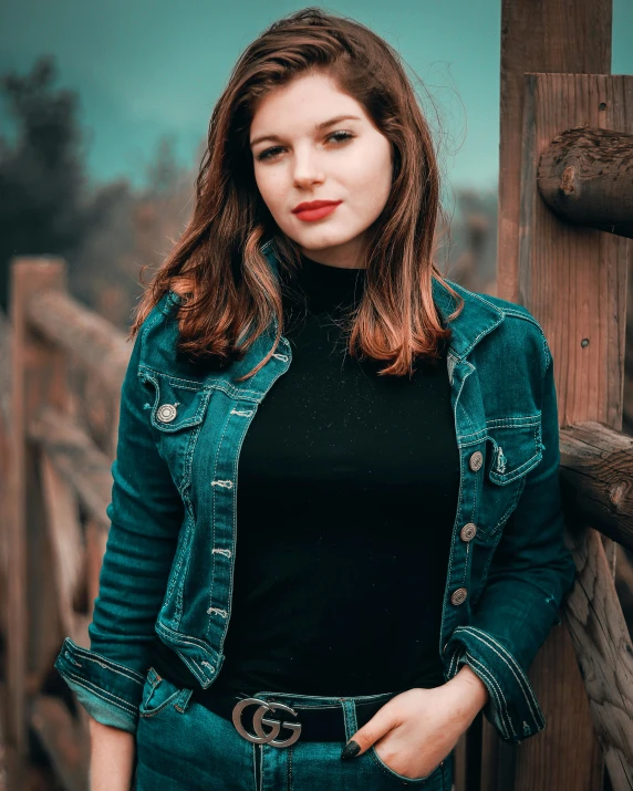 a woman standing on top of a wooden bridge, an album cover, inspired by Elsa Bleda, pexels contest winner, renaissance, wearing a jeans jackets, headshot profile picture, black+velvet+red+turquoise, portrait sophie mudd