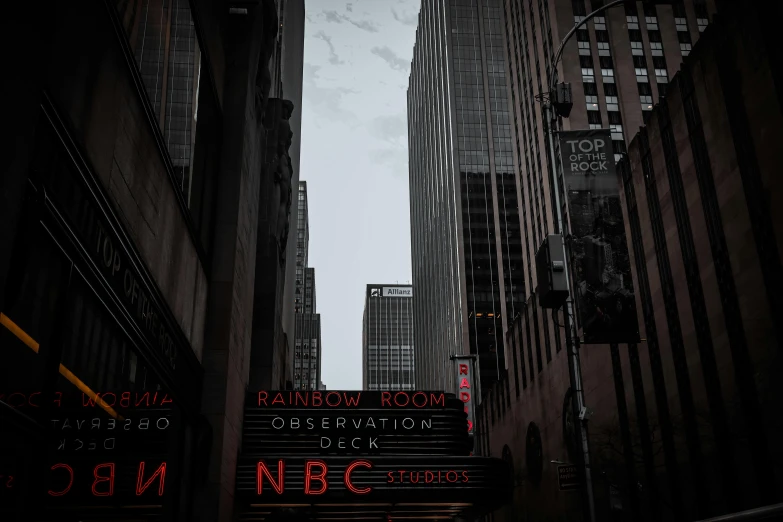 a city street filled with lots of tall buildings, by Dan Frazier, unsplash contest winner, neo-figurative, dark tv show style, thumbnail, broadway, red selective coloring