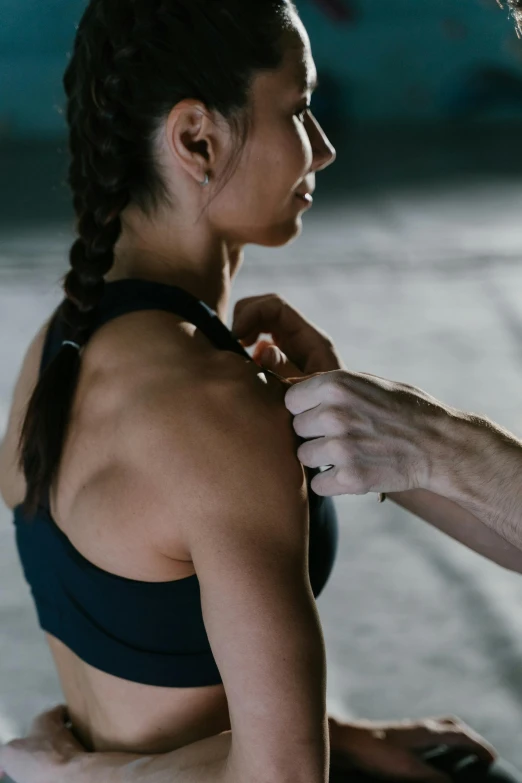 a man helping a woman fix her bra, by Adam Marczyński, pexels contest winner, showing her shoulder from back, athletic crossfit build, profile image, shoulder - length