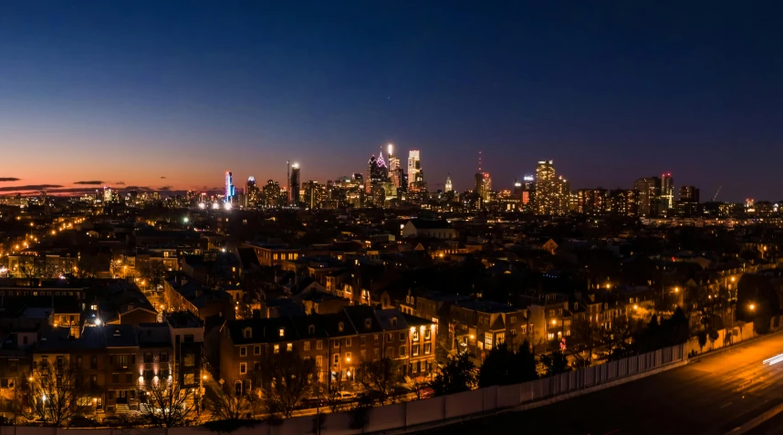 an aerial view of a city at night, pexels contest winner, always sunny in philadelphia, ultrawide landscape, skyline view from a rooftop, high res photo