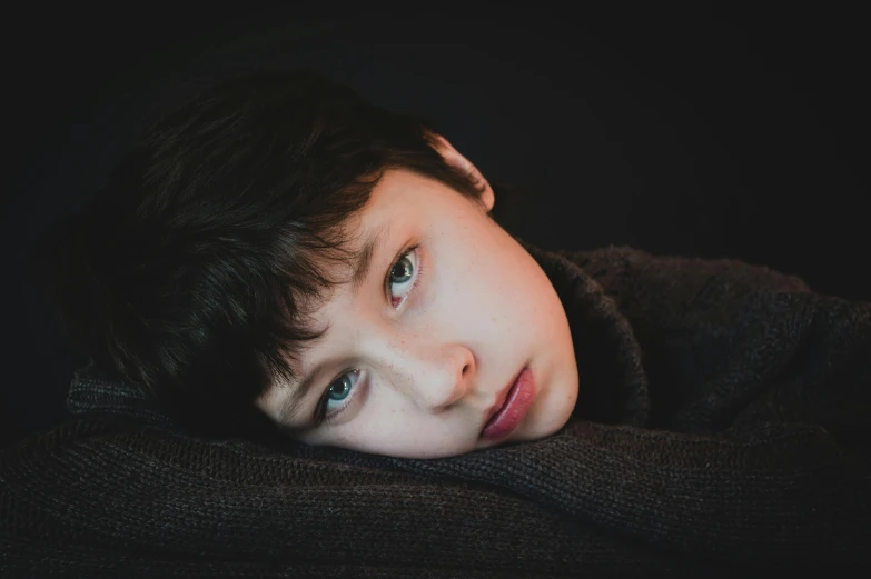 a close up of a person wearing a sweater, a character portrait, by Adam Marczyński, pexels contest winner, perfect face and boy, resting, boy has short black hair, professionally color graded