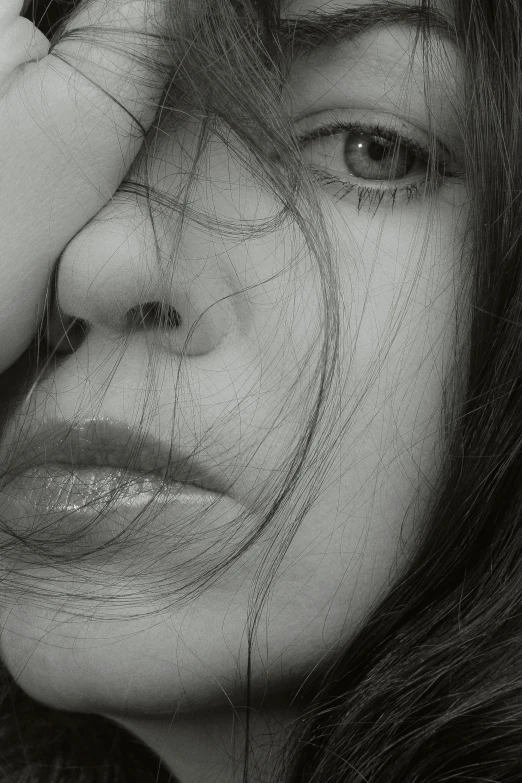 a black and white photo of a woman with long hair, pexels contest winner, photorealism, exhausted face close up, hiding, portrait of depressed teen, pale - white skin