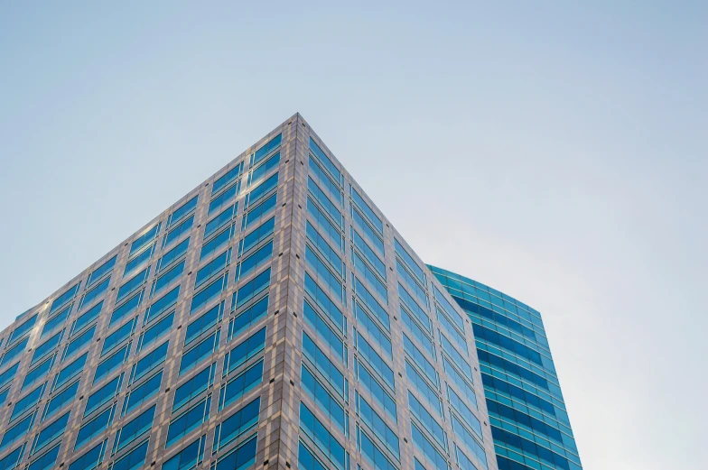 a very tall building with a lot of windows, unsplash, sky blue, capital plaza, 2000s photo, square lines