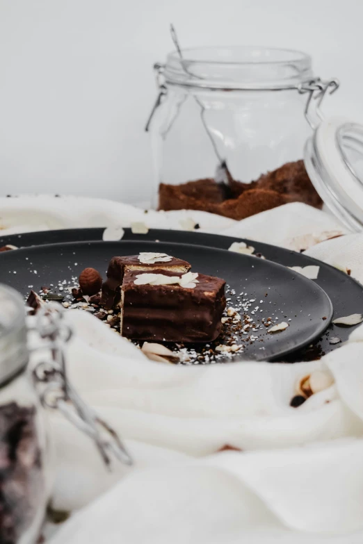 a close up of a plate of food on a table, a still life, unsplash, romanticism, fully chocolate, layers, finely textured, soft skin