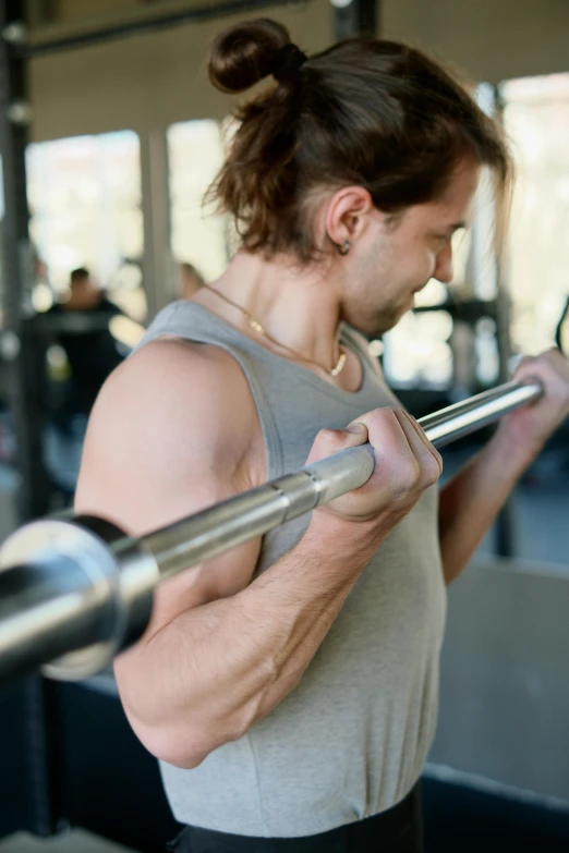 a man holding a barbell in a gym, trending on pexels, renaissance, square, very sweaty, center of image, australian