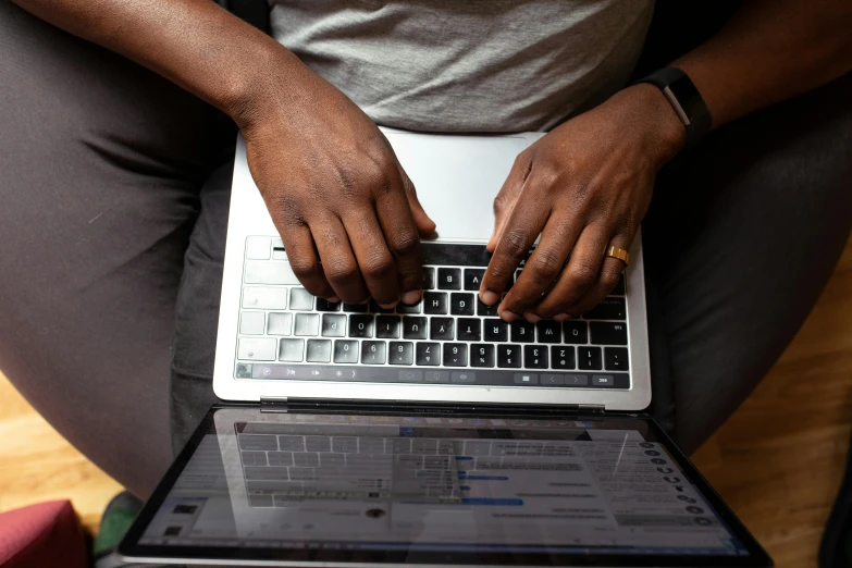 a close up of a person typing on a laptop, by Carey Morris, black man, thumbnail, centered shot, multiple stories