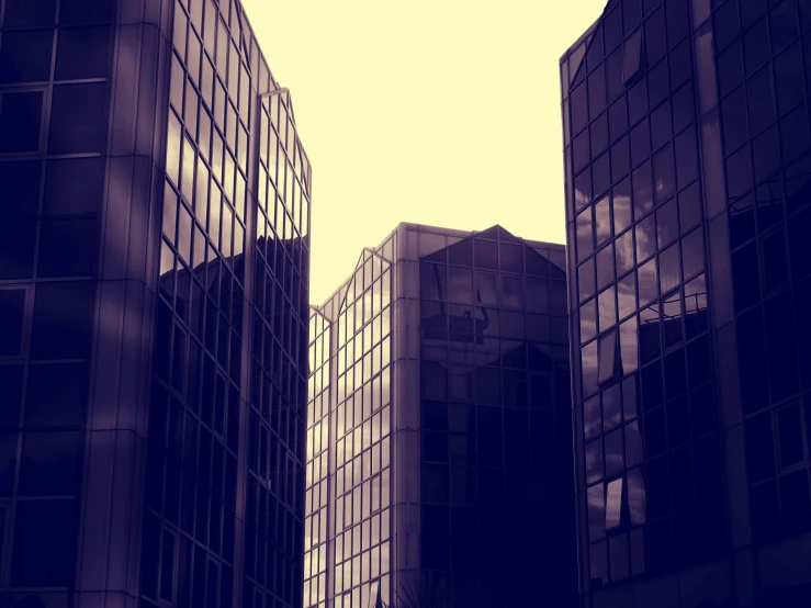 a couple of tall buildings sitting next to each other, inspired by Richard Wilson, unsplash, brutalism, retro effect, low quality photo, parallax », corporate business