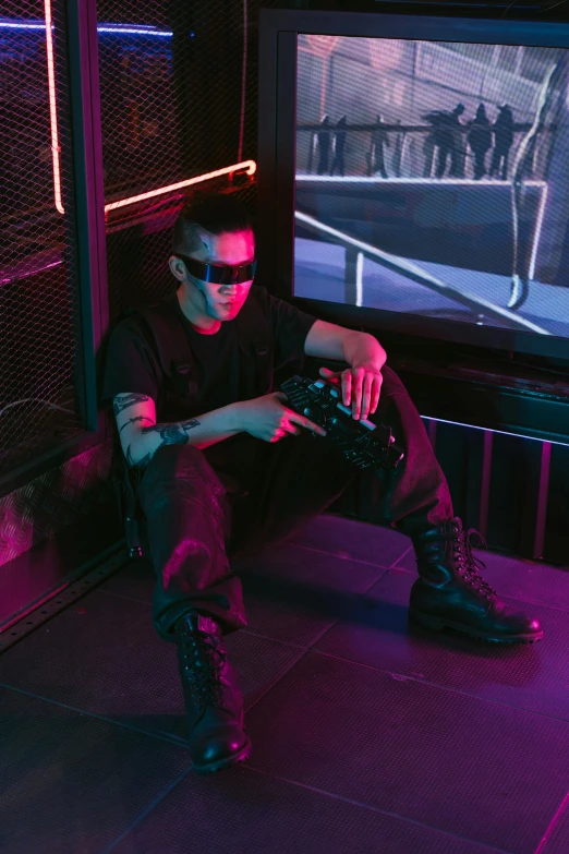 a man sitting in front of a tv playing a video game, cyberpunk art, inspired by Zhu Da, trending on pexels, holography, wearing shiny black goggles, photograph of a techwear woman, mall goth, badass pose