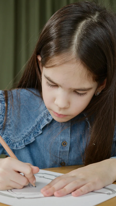 a little girl sitting at a table with a pencil and paper, pexels, hyperrealism, girl with dark brown hair, thumbnail, gif, concentration