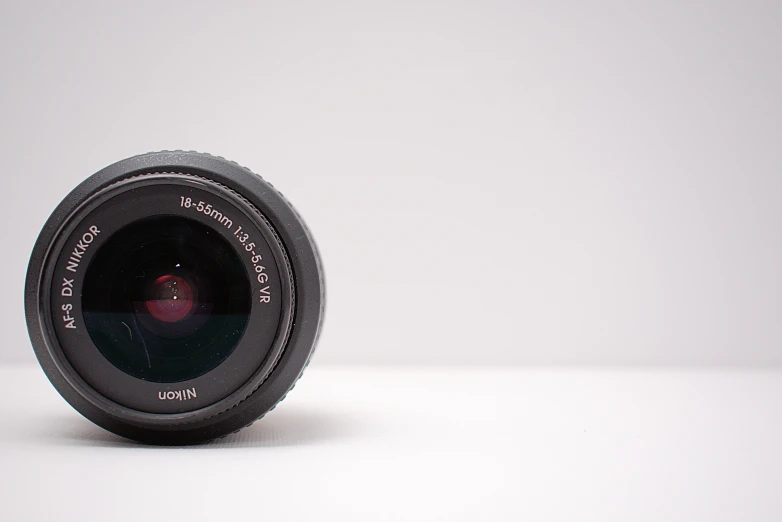 a close up of a camera lens on a table, by Gavin Hamilton, minimal. sharp focus, ((sharp focus))