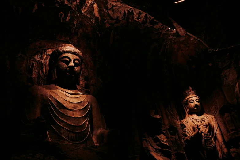 a couple of statues sitting next to each other, pexels contest winner, mingei, dark cave room, wētā fx, buddhist architecture, 2 0 0 0's photo